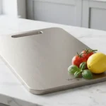 Vanotium Titanium Cutting Board on modern kitchen counter with fresh vegetables
