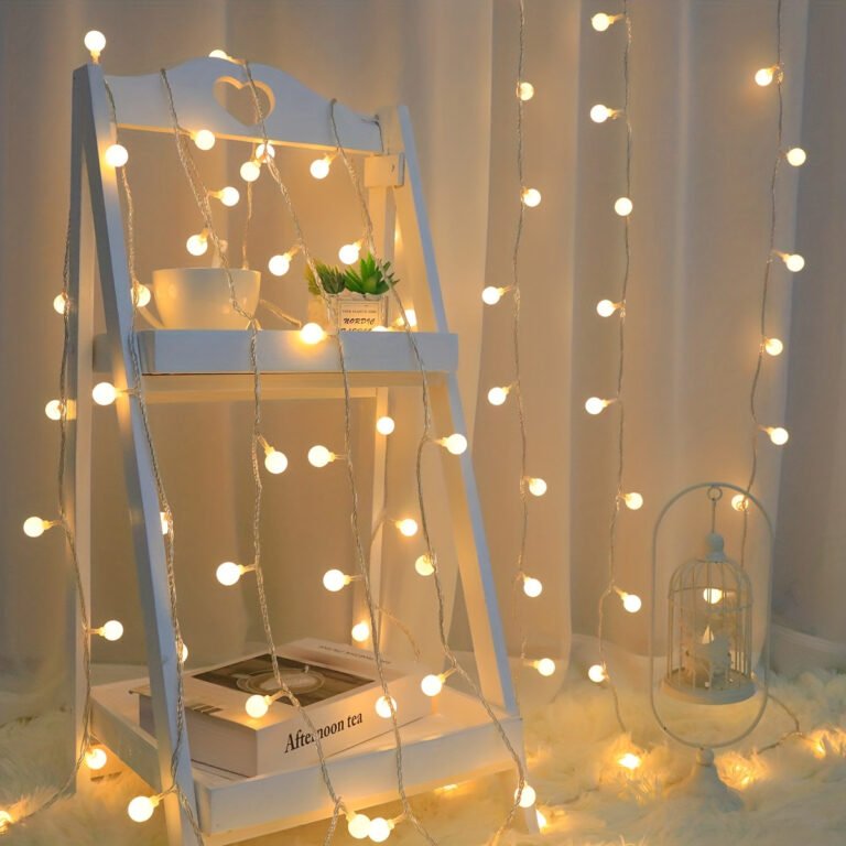 26 Temu Bedroom Finds for Better Sleep (17 Under $10) 12 Warm white battery LED globe string lights hung over a headboard with no outlet needed